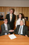 Dr Kevin Murfitt shaking hands with BCA person whilst Gerard Menses and Nadia Mattiazzo look on