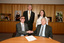 Dr Kevin Murfitt shaking hands with BCA person whilst Gerard Menses and Nadia Mattiazzo look on