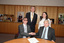Dr Kevin Murfitt shaking hands with BCA person whilst Gerard Menses and Nadia Mattiazzo look on