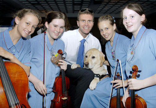 Gerard Gosens with schoolgirls orchestra members