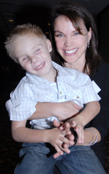 Sigrid Thorton with Andrew Parkinson in her lap