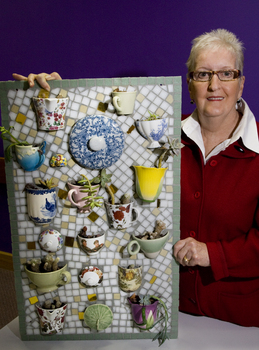 Woman with a mosaic of teacups