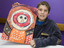 Boy with drawing of face and torso