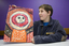 Boy with drawing of face and torso
