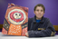 Boy with drawing of face and torso