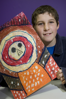 Boy with drawing of face and torso