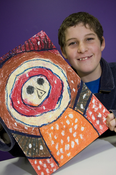 Boy with drawing of face and torso