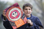 Boy with drawing of face and torso