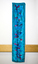 Blue dyed material with darker blue and pink against interior wall