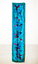 Blue dyed material with darker blue and pink against interior wall, with wood panelling removed