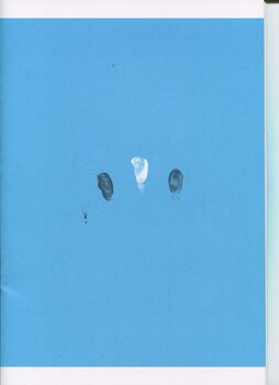 Two black fingerprints and one white fingerprint on a blue background