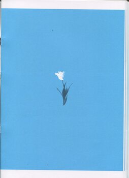 White smudge forming a flower with black smudges underneath as the leaves 