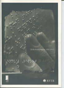 Fingers reading Braille with Braille lettering on cover