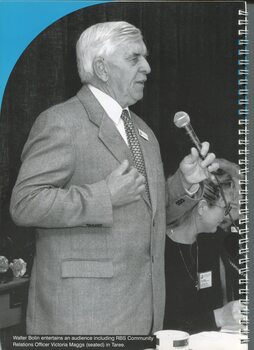Walter Bolin speaks to a group with Victoria Maggs seated beside him