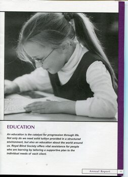 Image of school girl wearing glasses looking at a piece of paper