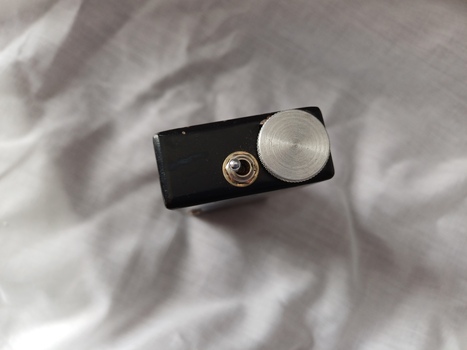 Toggle switch and battery compartment at end of sensor