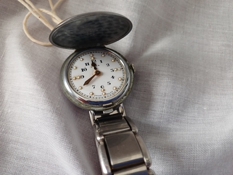 Braille watch face as underside of cover