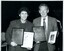 Arnold Zable and James Wright with plaques and book