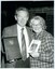 James Condon with unidentified female holding plaque and book
