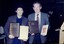 Arnold Zable and James Wright with plaques and book