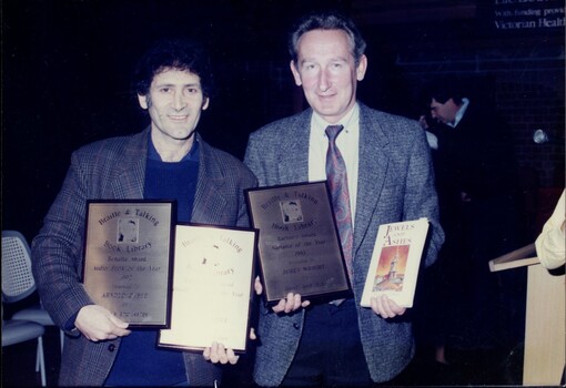 Arnold Zable and James Wright with plaques and book