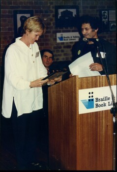 Meme McDonald being presented with her award