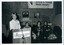 Meme McDonald at the podium with Lorna Hayted, Rose Blustein and Arnold Zable looking on
