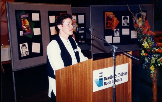 Rose Blustein at the podium during the event