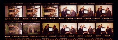 Negatives of three men with screen and arch at Enfield