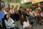 Audience in the browsing library listening to Gerard Menses, Graeme Turner first on left, Cherry Johnson in front of video camera