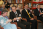 Audience in browsing library pull crackers including Tony Shepherd