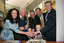 Marina Prior, Reuben Ryan, Jennifer, Gibbons, Tony Shepherd, Graeme Innes, Greg McKibbin and Jarryd Clifford cut the cake