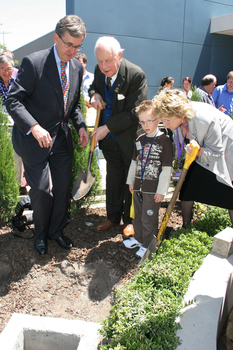 Gerard Menses, Reuben Ryan, Jarryd Clifford and Jennifer Gibbons bury the time capsule