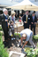 Reuben Ryan, Jarryd Clifford and Jennifer Gibbons watch the gardener caulk the covering plate, with Graeme Innes and Gerard Menses
