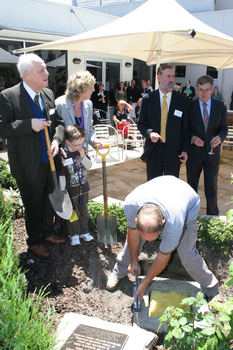 Reuben Ryan, Jarryd Clifford and Jennifer Gibbons watch the gardener caulk the covering plate, with Graeme Innes and Gerard Menses