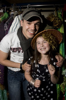 Anthony Callea and Kate Law amongst the costumes backstage at Wicked