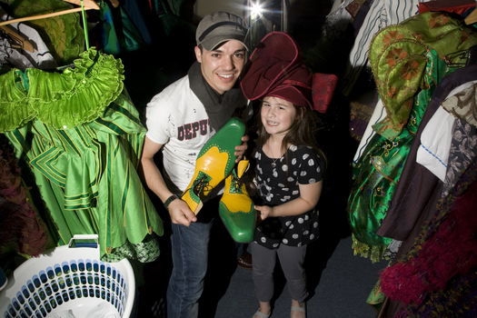 Anthony Callea and Kate Law amongst the costumes backstage at Wicked