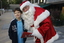 Carols launch: Nicholas Law and Santa with Carols program