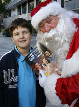 Carols launch: Nicholas Law and Santa with Carols program