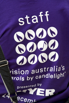 Purple Carols tshirt worn by staff members