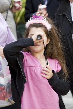 Carols launch: Kate Law looking through a magnifier