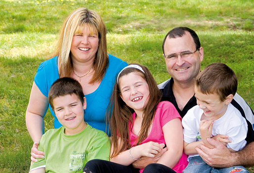 The Law family sitting on the grass