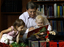 Ray Martin with two children and Christmas decorations