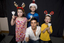 Kate, Nicholas and Jacob Law with Anthony Callea holding candles and wearing Christmas hats