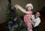 Kate Law placing an ornament on the Christmas tree with Anthony Callea