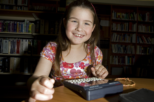 Kate Law using a Franklin Language Master dictionary