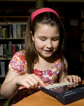 Kate Law using a Franklin Language Master dictionary