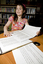 Kate Law reading a large print book in the Browsing Library