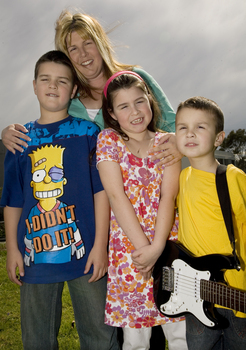 Nicholas, Jayne, Jacob and Kate Law outside at Kooyong