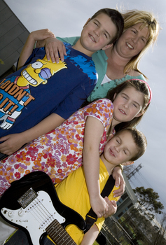 Nicholas, Jayne, Jacob and Kate Law outside at Kooyong